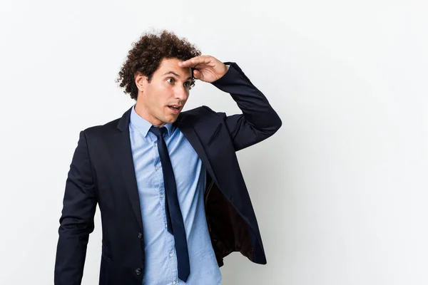 Young Business Curly Man White Background Looking Far Away Keeping — Stock Photo, Image