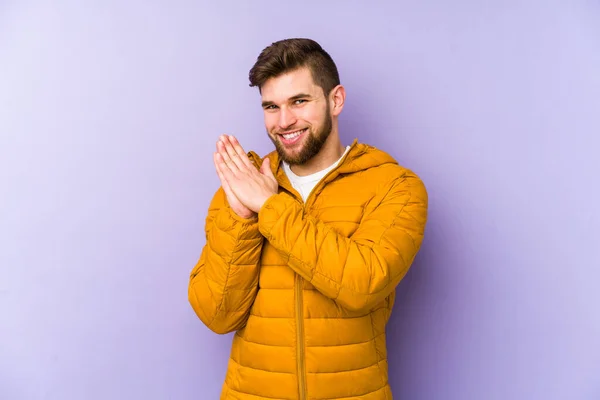 Young Man Isolated Purple Background Feeling Energetic Comfortable Rubbing Hands — Stock Photo, Image