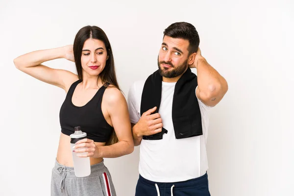 Kafkasyalı Genç Sporcu Çift Başlarının Arkasına Dokunuyor Düşünüyor Bir Seçim — Stok fotoğraf