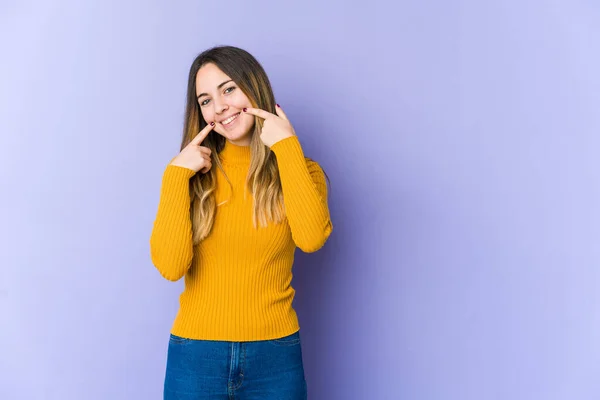 Young Caucasian Woman Isolated Purple Background Smiles Pointing Fingers Mouth — Stock Photo, Image