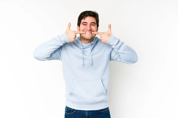 Ung Man Isolerad Vit Bakgrund Leenden Pekar Finger Munnen — Stockfoto