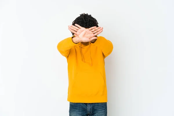 Young african american rasta man keeping two arms crossed, denial concept.