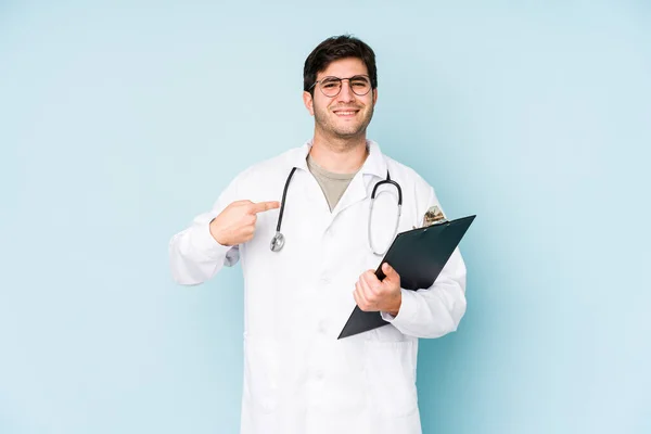 Young Doctor Man Isolated Blue Background Person Pointing Hand Shirt — Stock Photo, Image