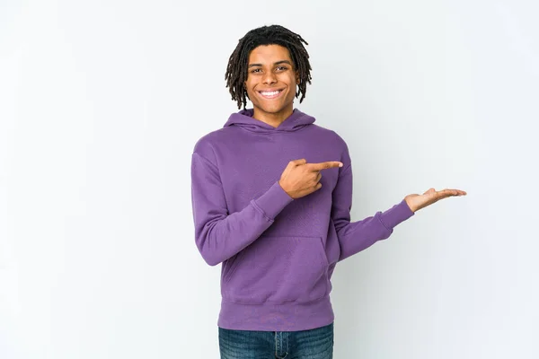 Young African American Rasta Man Excited Holding Copy Space Palm — Stock Photo, Image