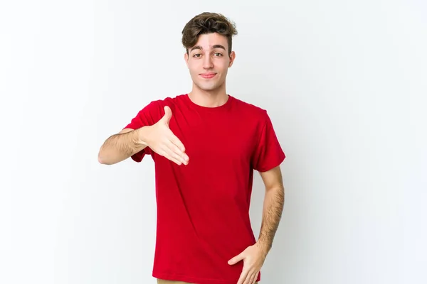Jonge Blanke Man Geïsoleerd Witte Achtergrond Stretching Hand Camera Groet — Stockfoto