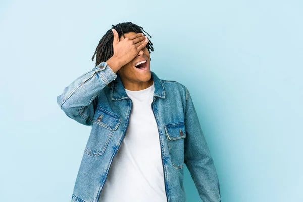 Young Black Man Wearing Jeans Jacket Covers Eyes Hands Smiles — Stock Photo, Image