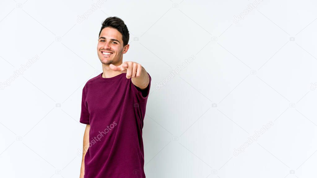 Young caucasian man isolated on white background pointing to front with fingers.