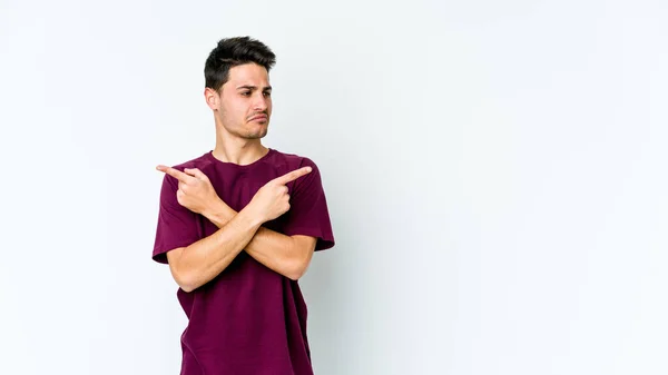 Young Caucasian Man Isolated White Background Points Sideways Trying Choose — Stock Photo, Image