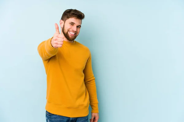 Young Caucasian Man Isolated Blue Background Smiling Raising Thumb — Stock Photo, Image