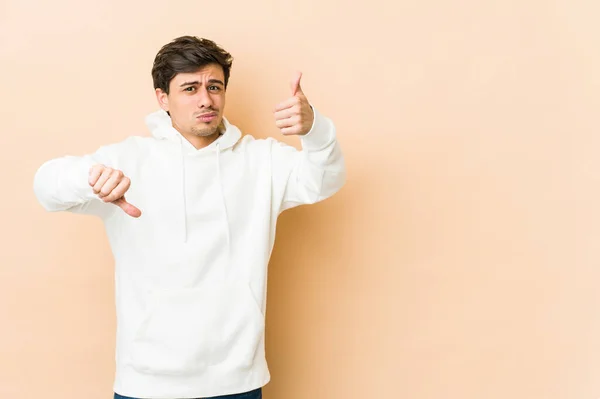 Young Cool Man Showing Thumbs Thumbs Difficult Choose Concept — Stock Photo, Image