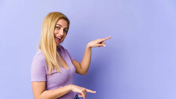 Young Blonde Caucasian Woman Excited Pointing Forefingers Away — Stock Photo, Image