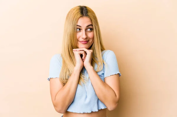 Young Blonde Caucasian Woman Keeps Hands Chin Looking Happily Aside — Stock Photo, Image