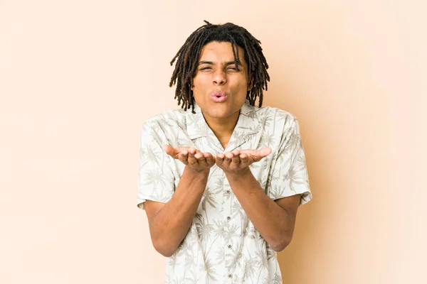 Young African American Rasta Man Folding Lips Holding Palms Send — Stock Photo, Image