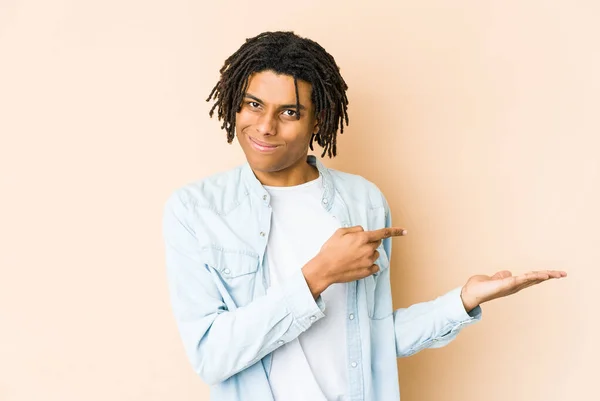 Young African American Rasta Man Excited Holding Copy Space Palm — Stock Photo, Image
