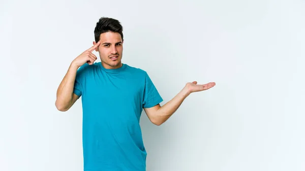 Jovem Caucasiano Isolado Sobre Fundo Branco Segurando Mostrando Produto Mão — Fotografia de Stock