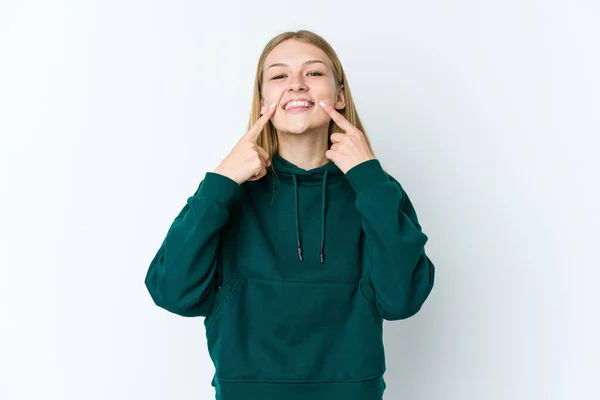 stock image Young blonde woman isolated on white background smiles, pointing fingers at mouth.