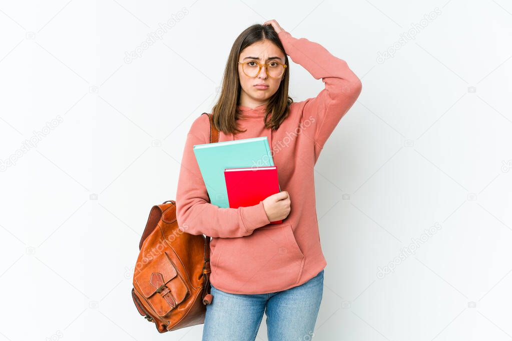 Young student woman isolated on white bakcground tired and very sleepy keeping hand on head.