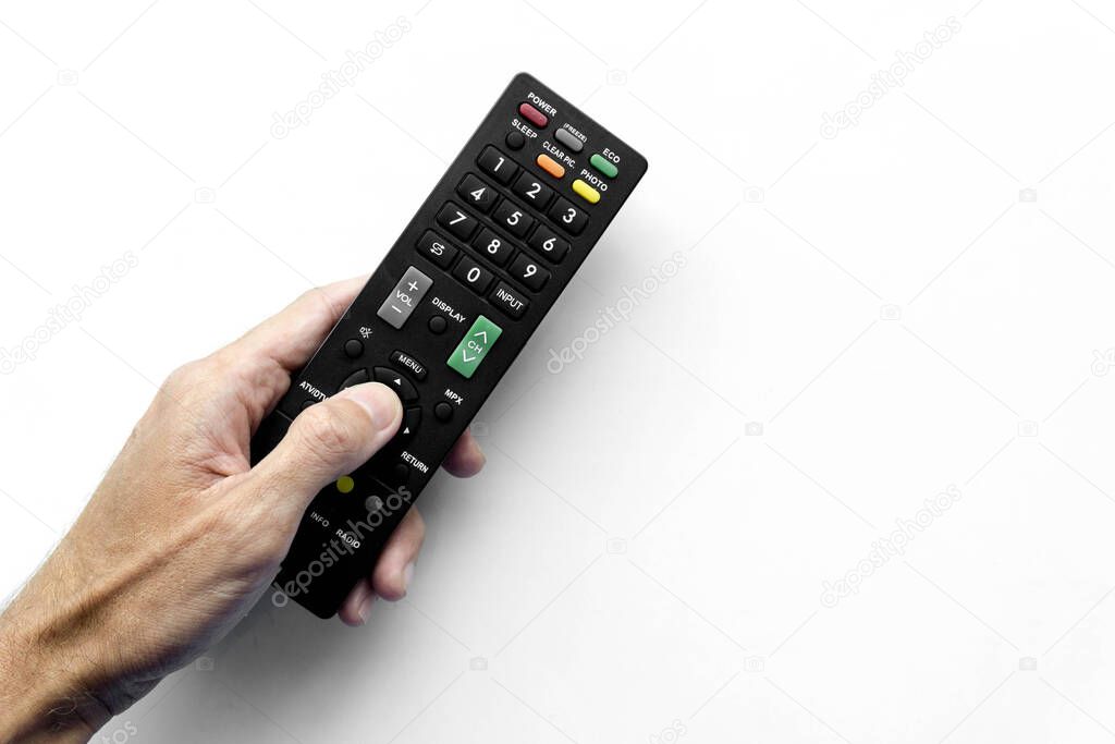Man holding remote control on white background