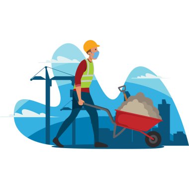 Bir inşaat işçisi el arabası kullanarak inşaat malzemesi taşıyor.