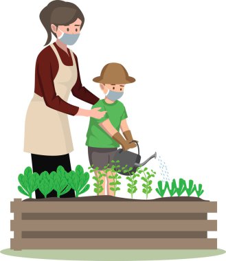 Oğlu tıbbi maske takarak bahçedeki bitkileri suluyor.