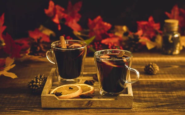 Cozy autumn drink. Hot mulled wine with oranges and spices. seasonal alcohol beverage, copy space.