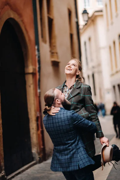 Beautiful family with walks in the old city of Lyon in France.A couple walks through old Lyon in France.