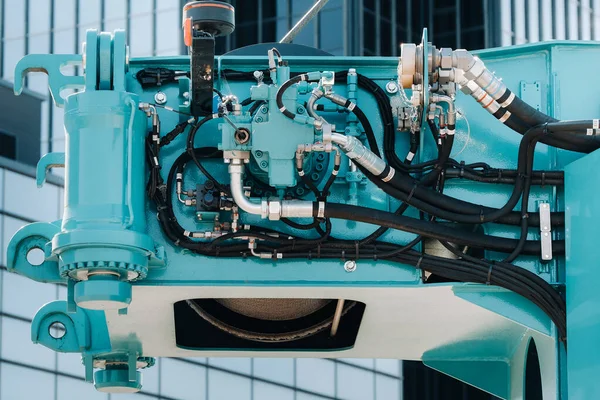 Hydrostatic crane engine.The control system of the crane engine.Lifting hydraulic Department on the truck crane.The hydraulic system of the engine.hydraulic hoses on the crane.autoparts.