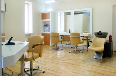 Interior of the barbershop in bright colors.Beauty salon. Place for hair cutting. clipart