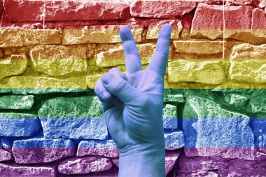 LGBT. Gökkuşağı arka planında zafer jesti. Şablon. Tasarımcı için içerik.