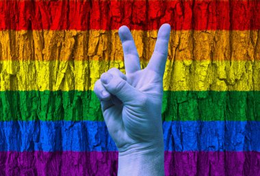 LGBT. Gökkuşağı arka planında zafer jesti. Şablon. Tasarımcı için içerik.