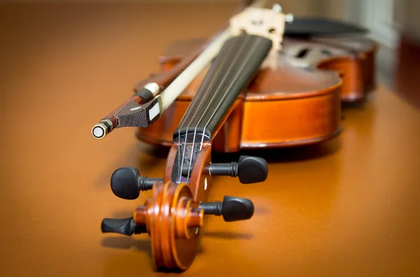 Musical instruments. Violin close-up. Photo on a wooden table.