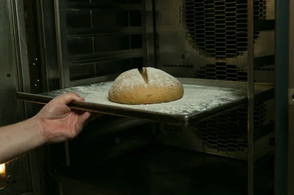 The process of making bread. The chef sends the bread to be baked.