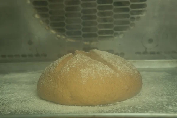 The process of making bread. The bread is baked in the oven.