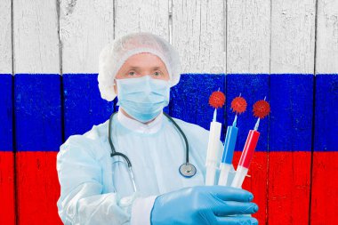 Coronavirus aşısı. Rus virologlar koronavirüse karşı bir aşı geliştirdiler. Bilim adamları virüsten kurtuldukları için seviniyorlar. Fotoğraf, Rus bayrağının arka planına karşı..