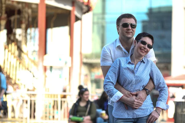 Portrait of a middle-aged man and woman. Emotion concept. A man and a woman who love each other are walking in the city.