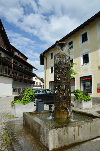 OBERAMMERGAU, GERMANY-05/28/2013: A small fountain on the street of the town.