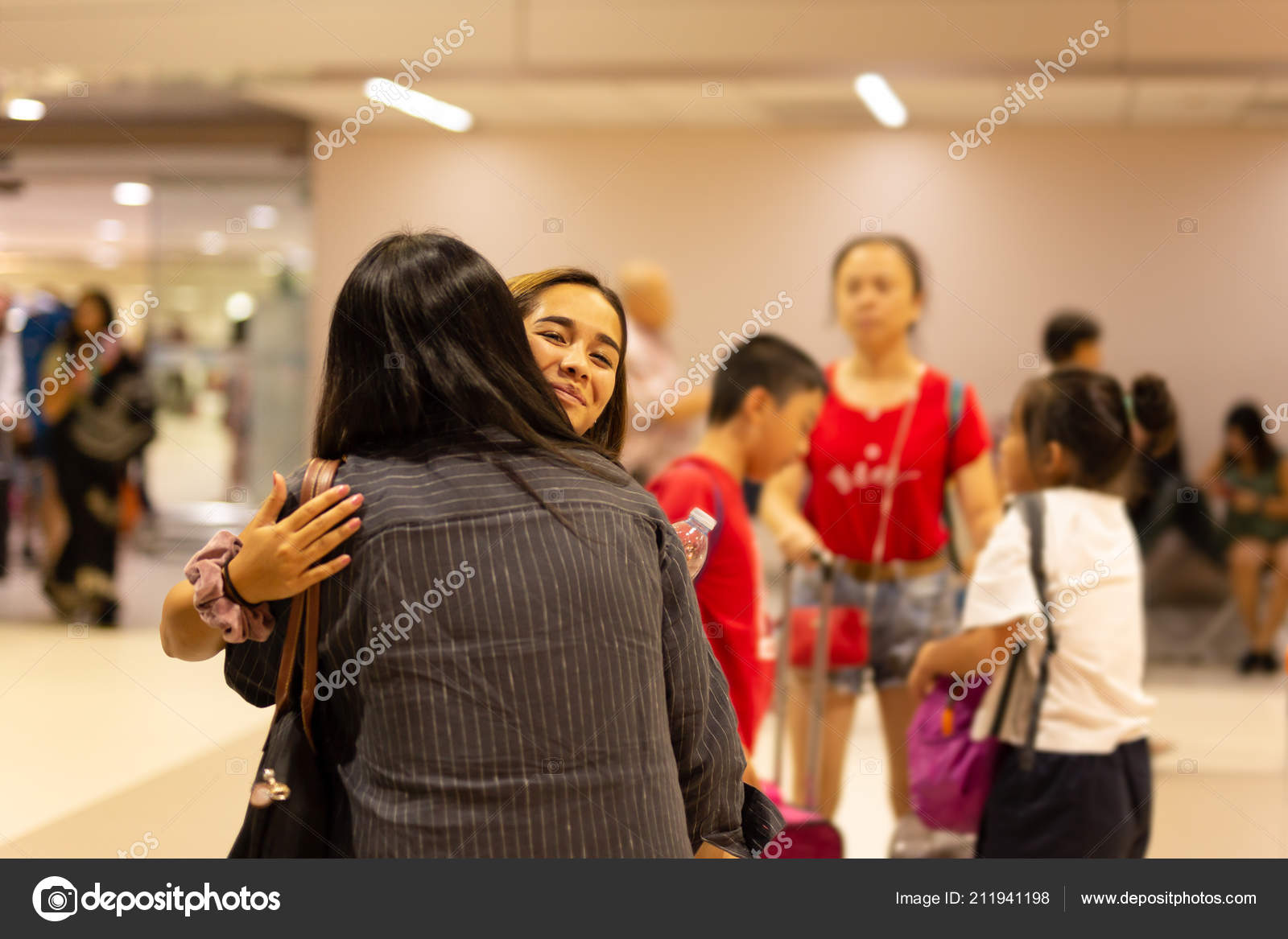 Happy Daughter Hugging Mother On Arrival At The Airport Stock Photo C Bignai 211941198