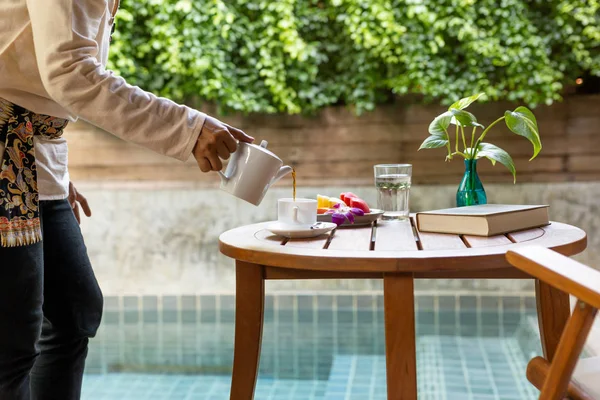 Waiter Serving Coffee Fresh Fruit Wooden Table Hotel Room — Stock Photo, Image