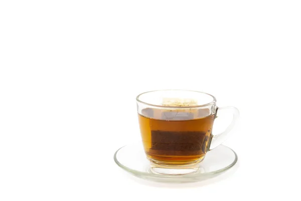 Tea bag in a glass cup isolated in white background. — Stock Photo, Image