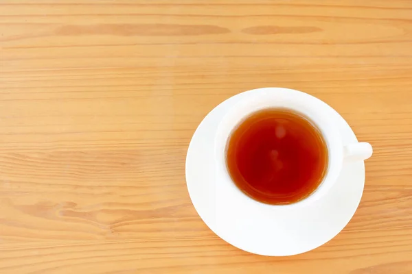 Top view cup of tea on wooden table. — Stock Photo, Image