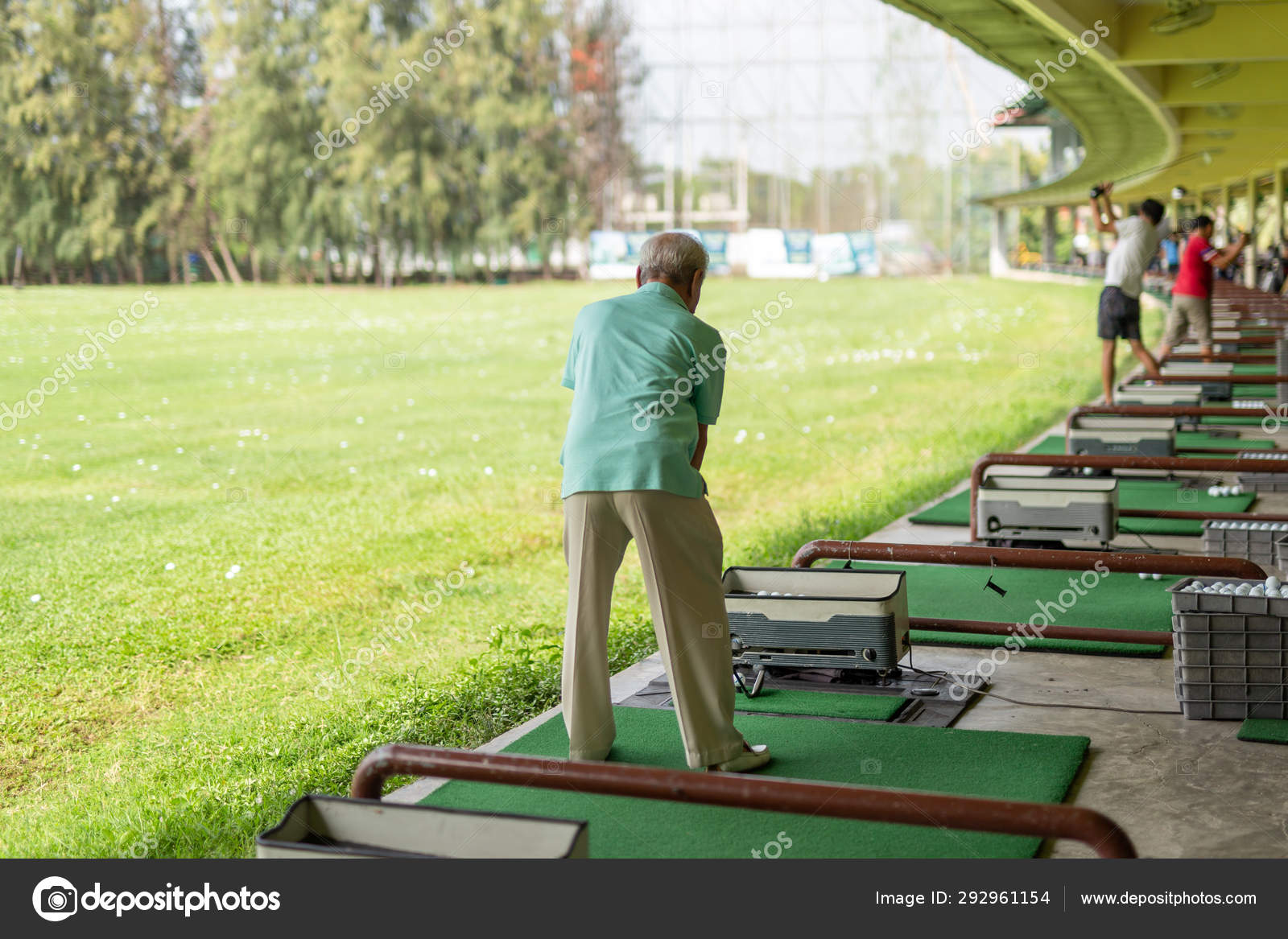 Senior Man Exercise Practicing His Golf Swing At Golf