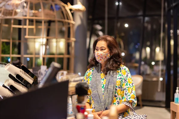 New normal women in protective mask order drink at cafe counter