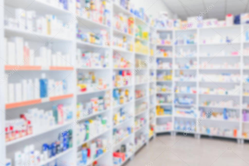 Pharmacy shelves filled with medication blur background