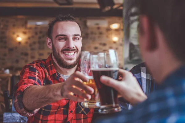 Friends Drinking Beer Clinking Glasses Bar Pub — Stock Photo, Image