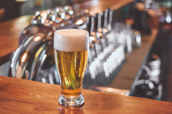 Beer glass on a bar table