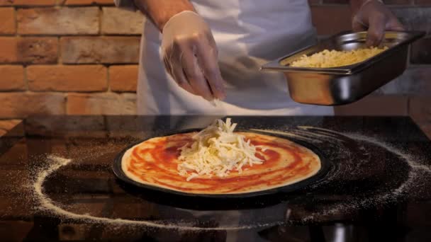 Process Preparing Pizza Cook Puts Cheese Flat Cake Made Raw — Stock Video