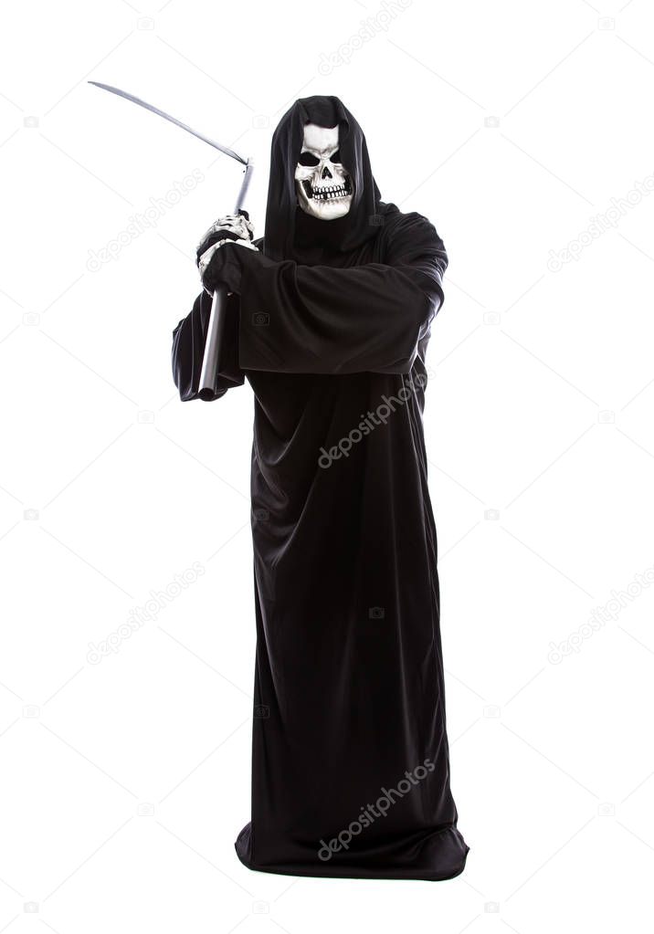 Costume of a skeleton grim reaper wielding a scary scythe.  The undead ghost is wearing a black robe to represent October Halloween holiday.  Isolated on a white background