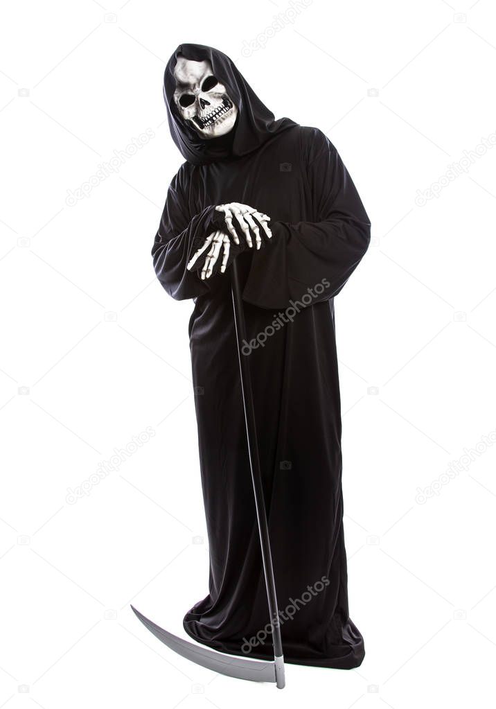 Costume of a skeleton grim reaper wielding a scary scythe.  The undead ghost is wearing a black robe to represent October Halloween holiday.  Isolated on a white background