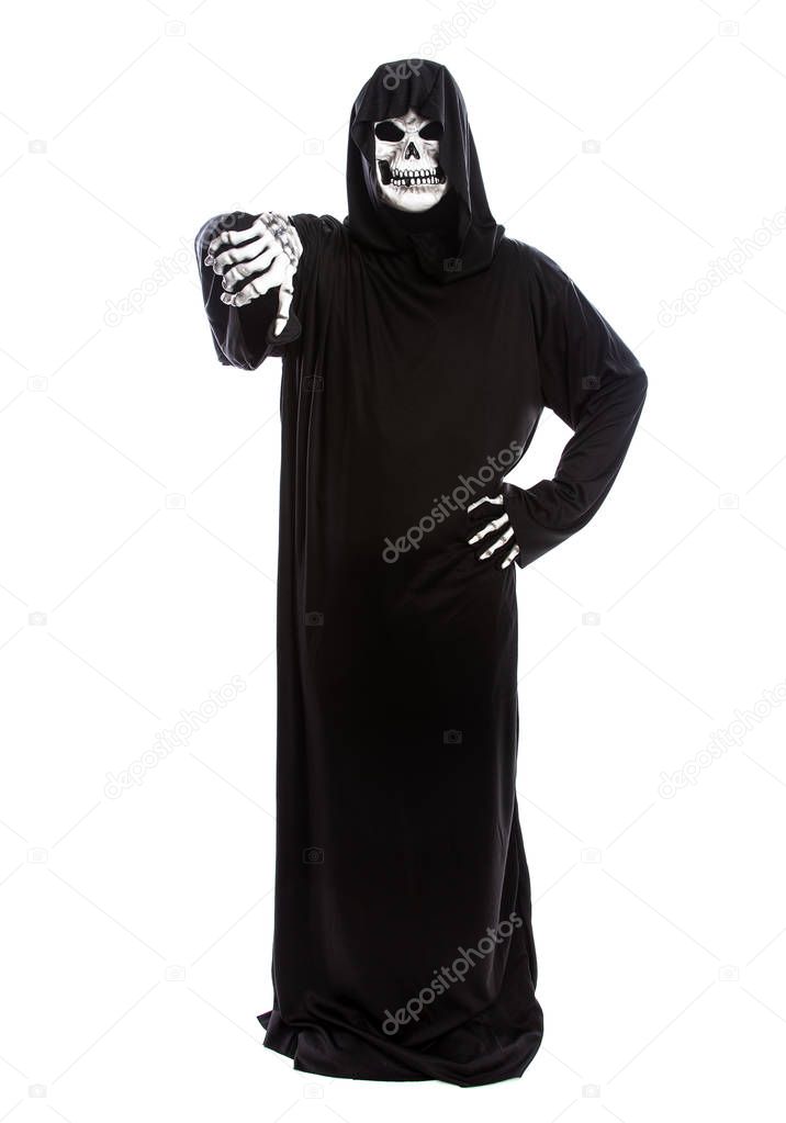 Halloween costume of a skeleton grim reaper wearing a black robe on a white background gesturing thumbs down