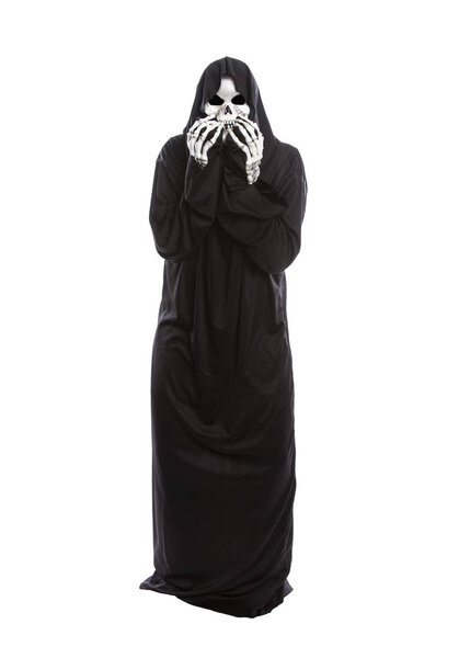 Halloween costume of a skeleton grim reaper wearing a black robe on a white background acting scared or frightened